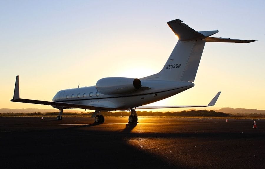 Aircraft on the runway against a violet dusk sky